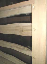 Detail view of the railing, showing the wooden pins